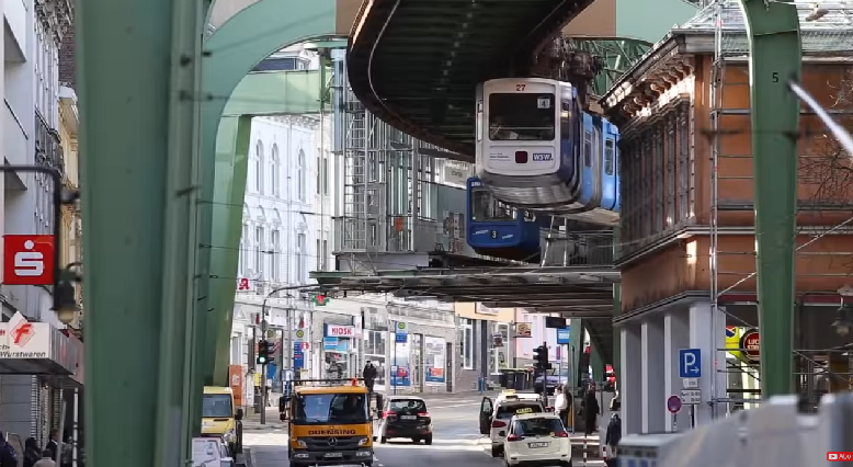 Without the conspicuous girders, this could be Lambton Quay, Wellington...